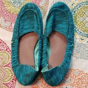 Sanuk teal and black slip on shoes